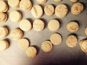 Filling the vanilla/white chocolate macarons. I sprinkled cinnamon on top for character.